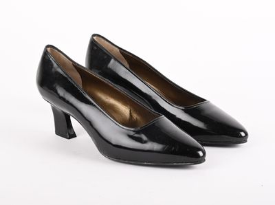 a pair of black pumps on a white background