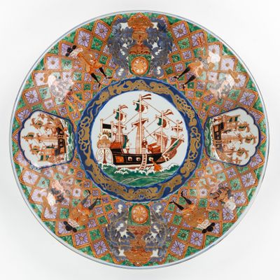 a decorative plate with a ship on it on a white background