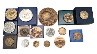 a lot of coins that are sitting in a blue box