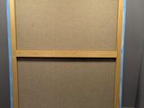 an image of a picture frame is taped and ready to be hung on a wall