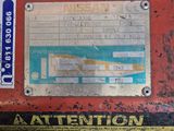 a red box with stickers on it sitting on a table