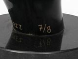 sculpture of a black cat on a black base with numbers on it ' s face