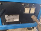 a close up of a blue machine with a hose attached to it ' s side
