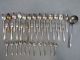 a lot of spoons and spoon spoons on the table