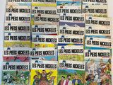 several comics are stacked on top of each other on a table
