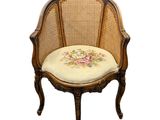 an image of a chair with a floral cushion on it