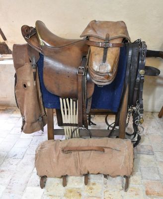 a saddle and a saddle on display in a room