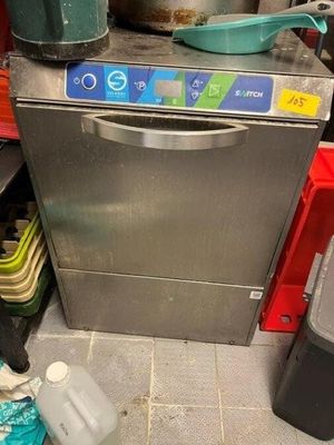 an image of a kitchen with a dishwasher and a trash can
