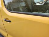 a yellow car that is parked on the side of the road