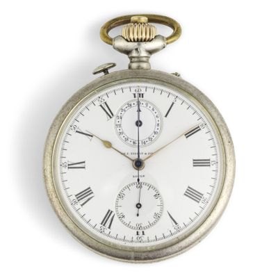 a silver pocket watch with roman numerals on the face