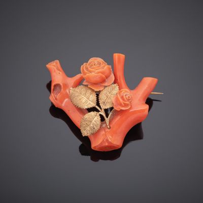 an image of a piece of carved coral with a rose on it