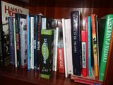 a book shelf with many books on it in a room