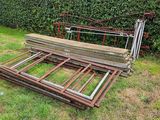 a pile of wood sitting on the ground in the yard