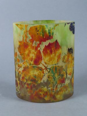 a close up of a vase with a flower design on it