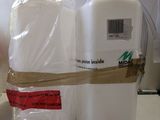 a bottle of milk and a bag of milk on a counter