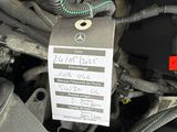 a picture of a car ' s engine with a tag attached to it