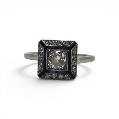 a close up of a diamond ring on a white background