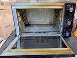 a microwave that is sitting on a table in a warehouse