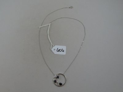 silver plated necklace with a black star and a circle pendant