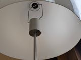 a close up of a lamp on a table in a room