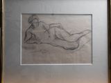 dessin représentant une femme nue allongée sur le ventre, dans un cadre doré
