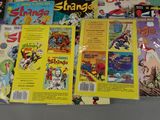 a lot of comic books sitting on a table