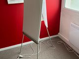 an image of a white easer in the corner of a room