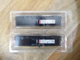 two ram modules in a plastic container on a table