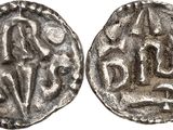 a silver coin with an image of a man and a woman on it