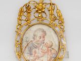an image of a picture of a woman holding a baby in a gold frame