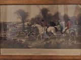 painting of a group of people riding horses in a wooded area