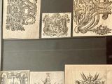a lot of drawings on the wall in this room