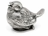 a silver figurine of a bird with a spoon in its mouth