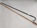 two different types of fishing rods on the table
