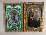 two framed pictures of a man and a woman on a wall