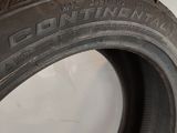 a close up of a tire on a white surface