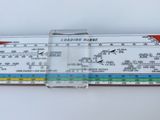 a close up of a ruler on a white surface