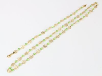 Collier et bracelets en or à motifs floraux alternés de pier…