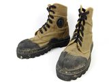 a pair of boots that are on a white surface