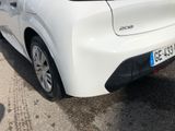 a white car that is parked in a parking lot