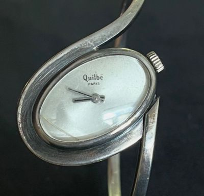 an image of a close up of a wrist watch with a curved band