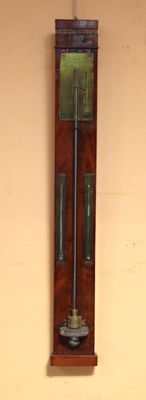 a grandfather clock hanging on the wall in the room
