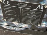 a black box with a label on it sitting on the ground