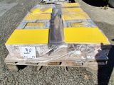 a pallet with a lot of boxes on it sitting on the ground