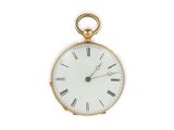 an antique gold pocket watch with roman numerals on the face