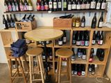 many bottles of wine sitting on the shelves in the room