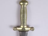 a close up of a knife on a white surface