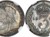 a close up of a coin with a crown on top of it