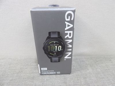the garmin watch is in the box on the table