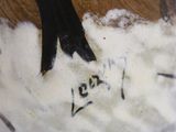 a close up of a vase with a horse on it